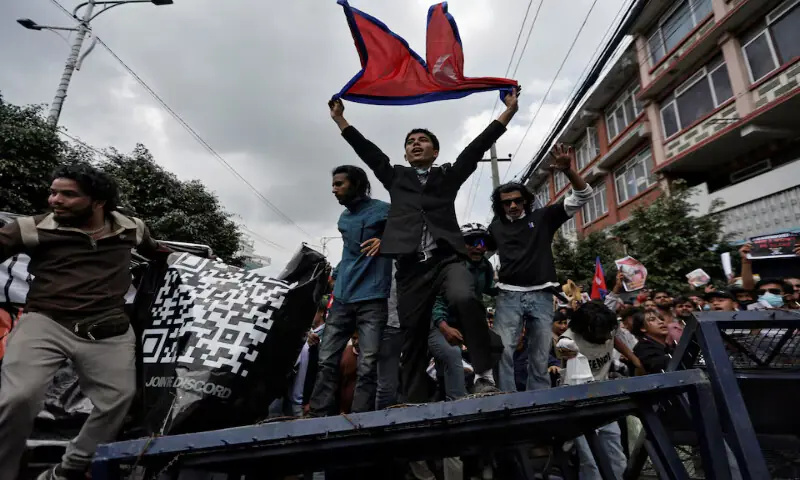 Demonstrators shout slogans as they stand on a barricade during a protest against corruption and the government’s decision to block several social media platforms in Kathmandu, Nepal, on Monday. – Reuters