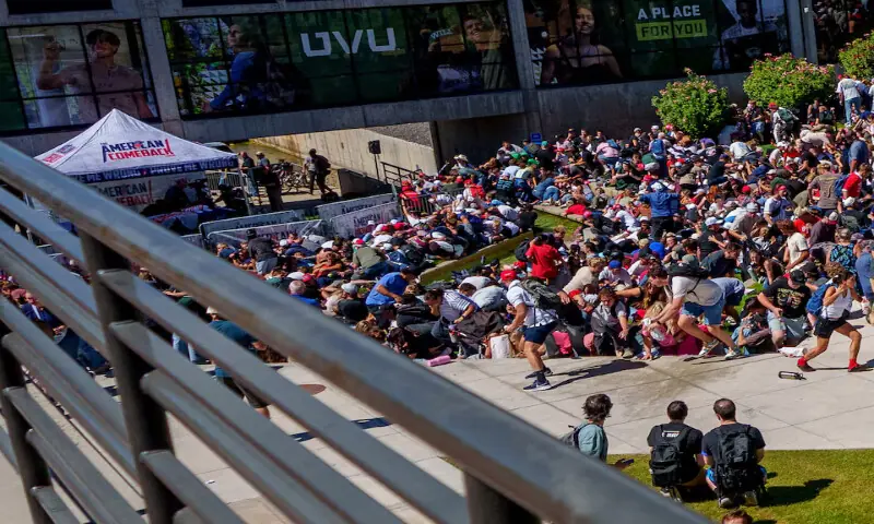 People run and crouch after US right-wing activist and commentator Charlie Kirk was shot at a Utah Valley University speaking event in Orem, Utah. – Reuters