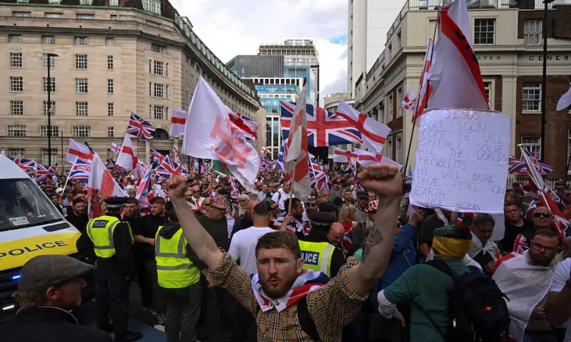 Protesters march on the day of an anti-immigration rally organised by British anti-immigration activist Stephen Yaxley-Lennon, also known as Tommy Robinson, in London, Britain. – Reuters