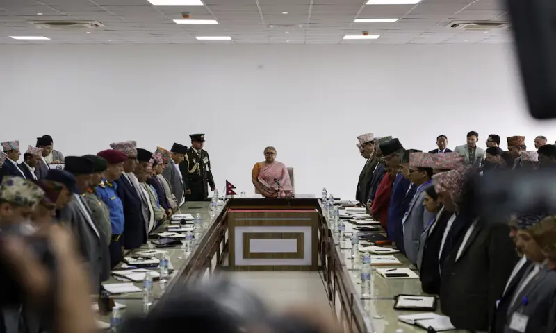 Newly sworn-in interim Prime Minister of Nepal, Sushila Karki, takes part in a moment of silence in memory of people who died in a protest after assuming the post in her office in Kathmandu. – Reuters.. Purchase Licensing Rights, opens new tab