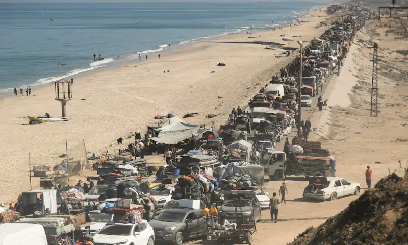 Displaced Palestinians, fleeing northern Gaza due to an Israeli military operation, move southward in the central Gaza Strip on Sunday. – Reuters