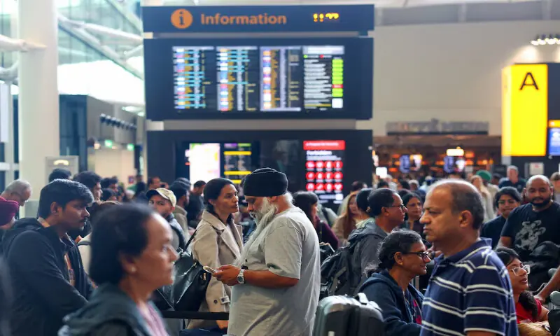 Travellers wait near check-in desks at Heathrow Airport Terminal 2 amid flight delays and cancellations in Greater London, Britain, on Saturday. – Reuters