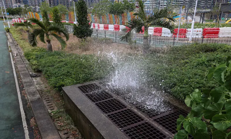 Seawater gushes from a drainage outlet as storm surge from Super Typhoon Ragasa causes backflow flooding in Hong Kong on Tuesday. – Reuters