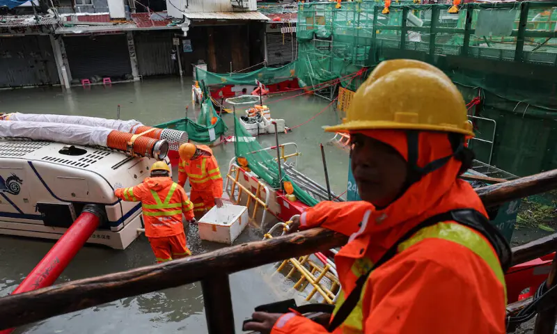 Workers use a robotic pump to remove floodwater from inundated areas in the aftermath of Super Typhoon Ragasa in Hong Kong, China. – Reuters