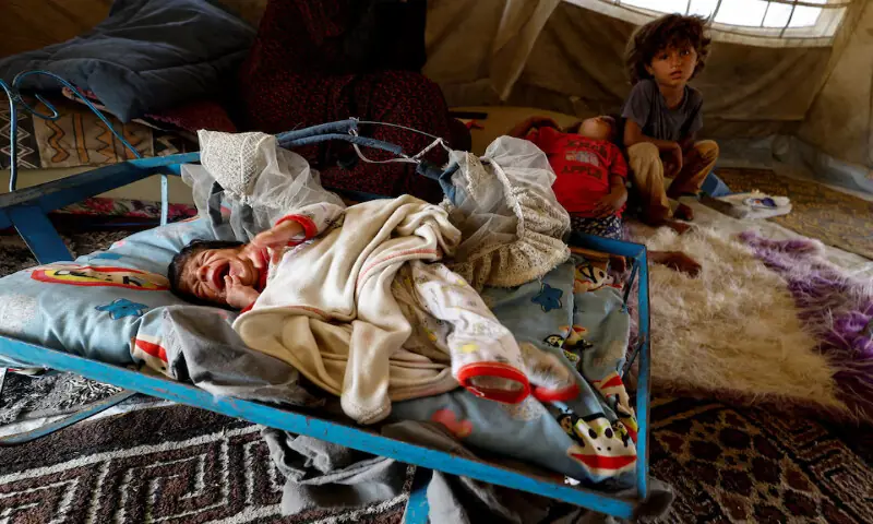 Palestinian children take shelter in a tent camp in Nuseirat, central Gaza Strip. – Reuters