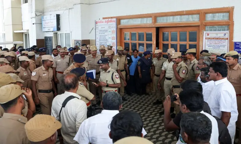 Police officers stand in front of a hospital following a stampede incident at a rally in Karur district of Tamil Nadu, India, on Sunday. – Reuters