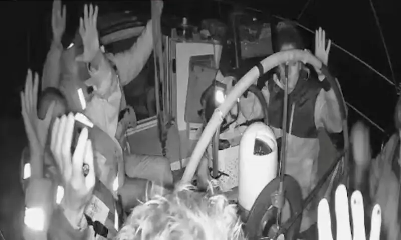 A screengrab shows the crew of the Gaza-bound vessel raising their hands as they are detained by Israeli soldiers on Thursday. – Reuters
