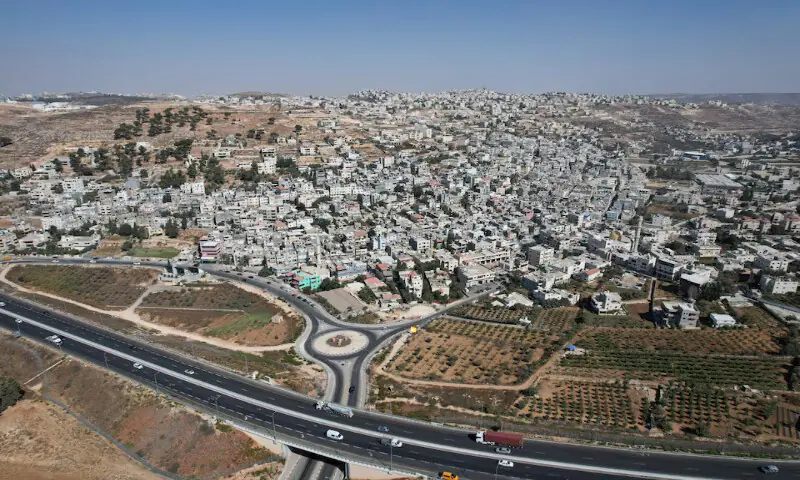 A drone view of Al Arroub refugee camp alongside a new road, part of the expansion of Israeli bypass roads connecting Israeli settlers in the West Bank with Jerusalem, in the Israeli-occupied West Bank. – Reuters