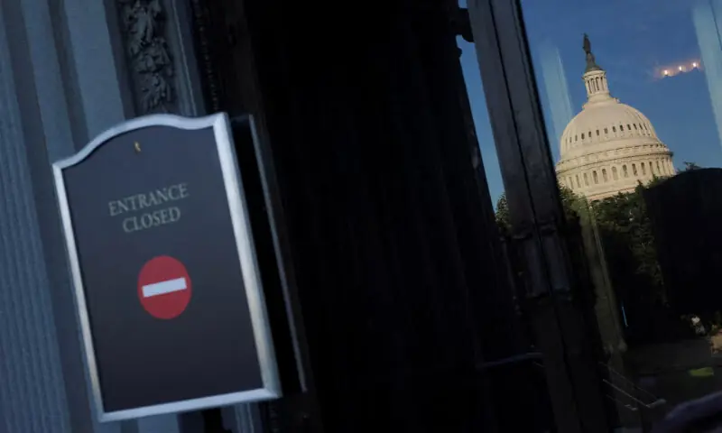 The US Capitol dome is reflected in the Library of Congress glass door, with the sign reading “Entrance closed” in the foreground, on the first day of a partial government shutdown in Washington, DC. – Reuters