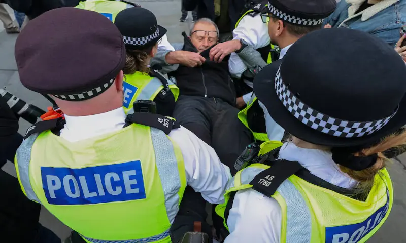 Police officers detain a protester during a mass demonstration against the British government’s ban on Palestine Action at Trafalgar Square in London. – Reuters