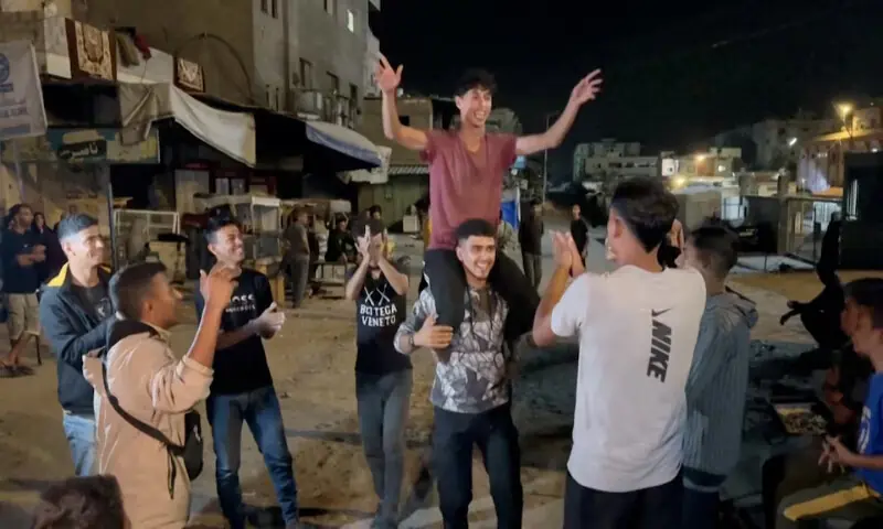 Palestinians celebrate on a street following the news that Israel and Hamas have agreed to the first phase of the Gaza peace plan in Khan Younis in the southern Gaza Strip. – Reuters