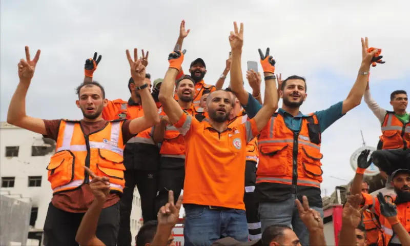 Palestinian emergency personnel celebrate, after US President Donald Trump announced that Israel and Hamas agreed on the first phase of a Gaza ceasefire, in Gaza City, on October 9, 2025. Reuters