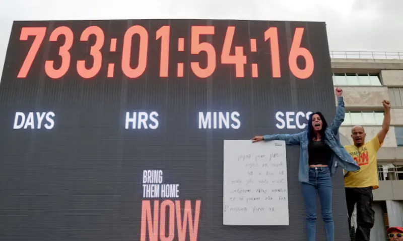 Einav Zangauker, the mother of hostage Matan Zangauker, holds a sign with a poem about calling for the return of all the hostages, at the ‘Hostages square’, after US President Donald Trump announced that Israel and Hamas agreed on the first phase of a Gaza ceasefire, in Tel Aviv, on October 9, 2025. Reuters