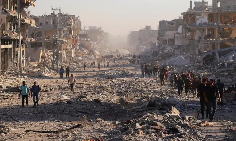 Gazans trek to ruined homes as Israeli forces pull back under ceasefire