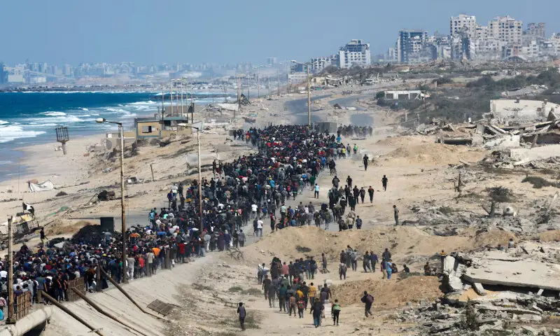 Palestinians, who were displaced to the southern part of Gaza during the war, walk along a road as they attempt to return north in the central Gaza Strip. – Reuters