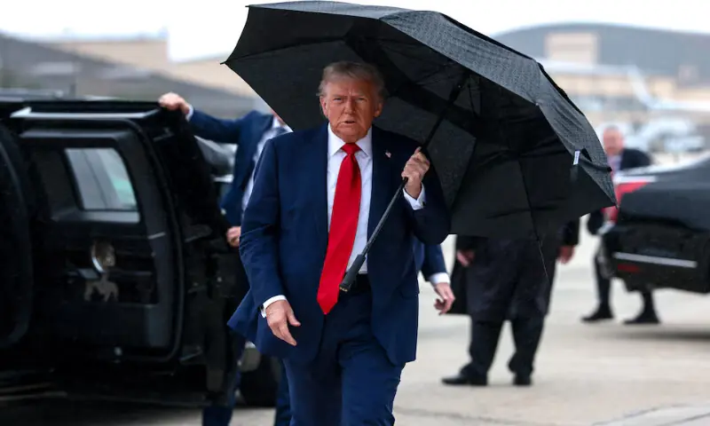 US President Donald Trump holds an umbrella before boarding Air Force One, as he departs for Israel, at Joint Base Andrews, Maryland, US. – Reuters