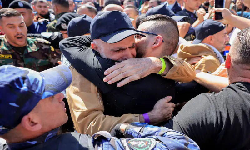 A freed Palestinian prisoner hugs his family member in Ramallah in the Israeli-occupied West Bank on Monday. – Reuters
