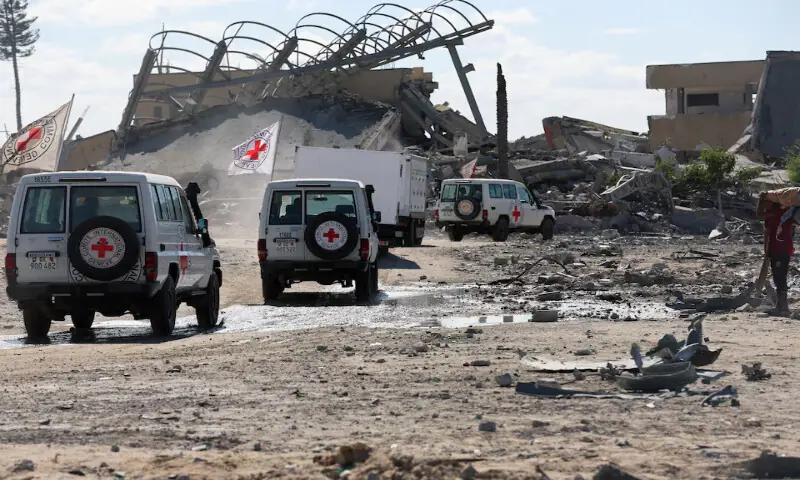 Red Cross vehicles escort a truck transporting the bodies of Palestinians who had been held in Israel during the war in Khan Younis in the southern Gaza Strip on Tuesday. – Reuters