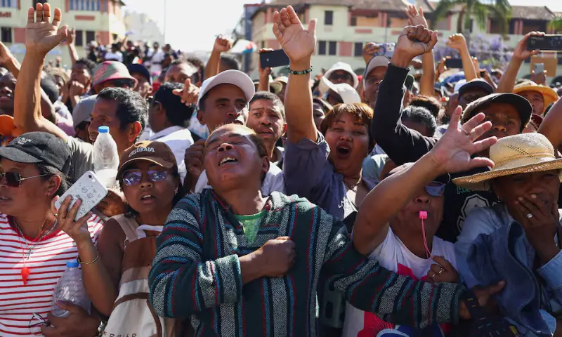 Locals react as members of Madagascar’s military arrive to join protesters during a nationwide youth-led demonstration against frequent power outages and water shortages, in Antananarivo, Madagascar, on Tuesday. – Reuters