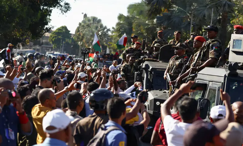 Members of the military look on as they leave after joining protesters in Antananarivo, Madagascar, on Tuesday. – Reuters