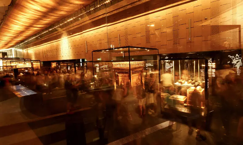 Visitors walk around the gallery of the ancient Egyptian king Tutankhamun. – Reuters