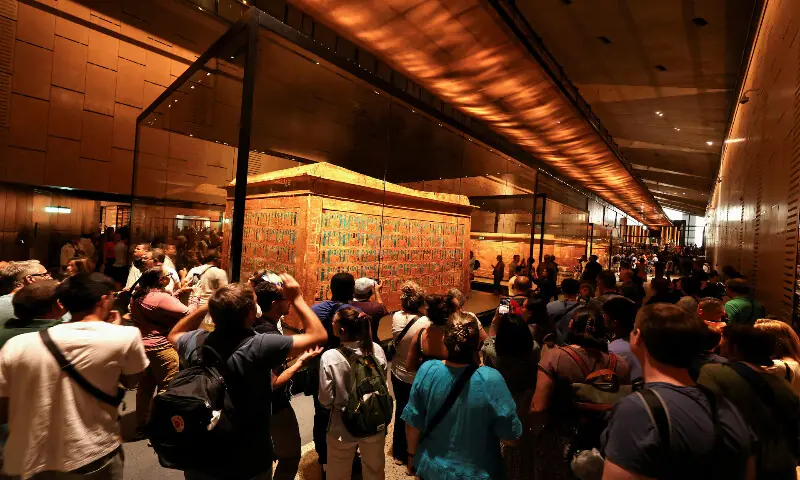 Visitors walk through the gallery of ancient Egyptian king Tutankhamun. – Reuters