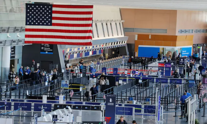 Travellers make their way through a TSA security checkpoint at Logan International Airport in Boston, Massachusetts. – Reuters