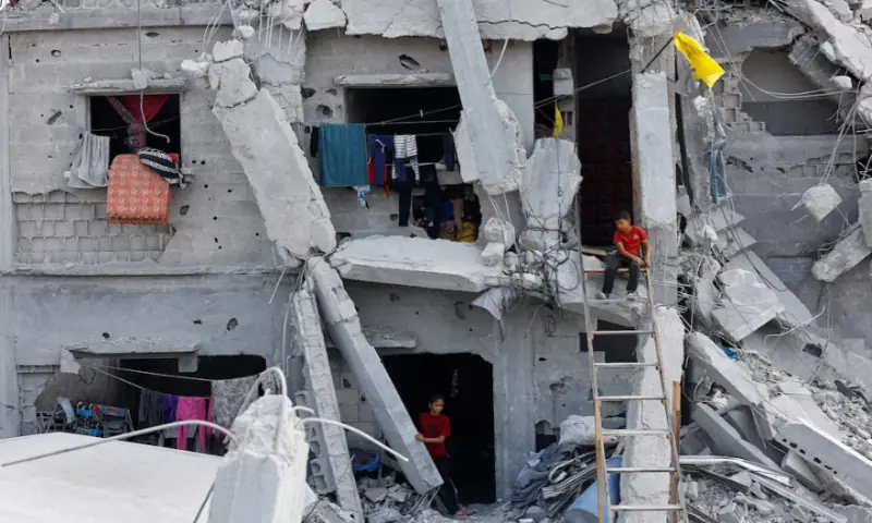 Palestinian children amid the rubble of destroyed buildings, during a ceasefire between Israel and Hamas, in Jabalia, northern Gaza Strip, on November 4, 2025. Reuters