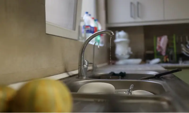 A small amount of water pours out of the faucet following a drought crisis in Tehran on November 9, 2025. Reuters