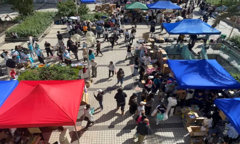 People visit a resource collection point set up by volunteers to provide supplies for residents impacted by the deadly fire, near the Wang Fu Court housing complex in Tai Po, Hong Kong, on November 28, 2025. Reuters