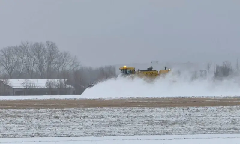 A vehicle clears snow during a winter storm at Greater Rochester International Airport in Rochester, New York. &ndash; Reuters