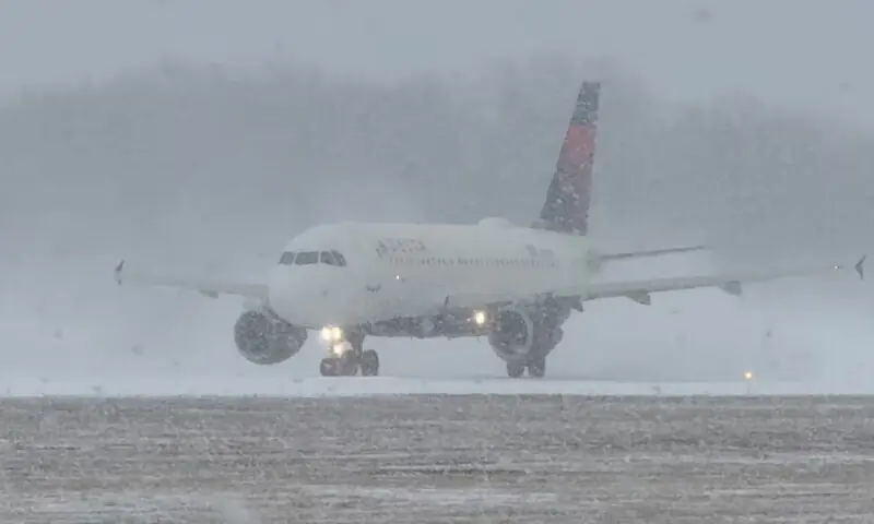 A Delta Air Lines plane prepares to take off during a winter storm at Greater Rochester International Airport in Rochester, New York. &ndash; Reuters