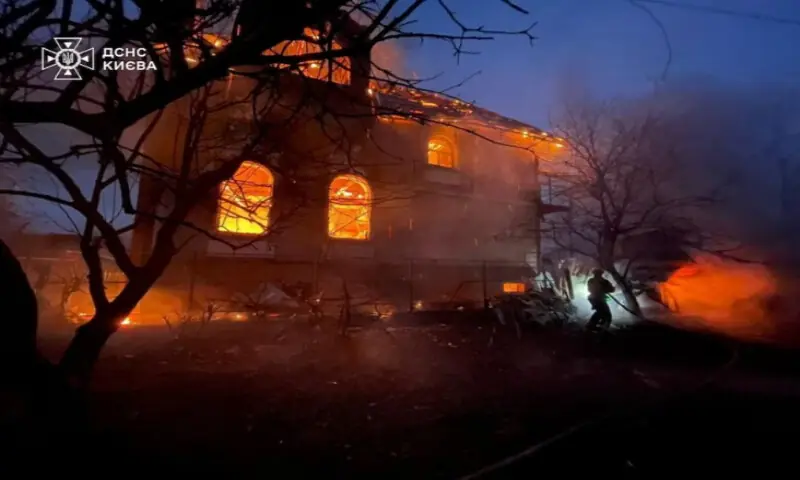 A firefighter works at the site of a residential building damaged during Russian missile and drone strikes, amid Russia&rsquo;s attack on Ukraine, in Kyiv, Ukraine, on December 27, 2025. Press service of the State Emergency Service of Ukraine/Reuters