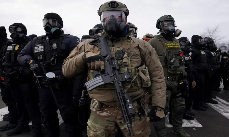 Members of US Customs and Border Protection and other law enforcement officials stand guard during a protest in Minneapolis, Minnesota. &ndash; Reuters