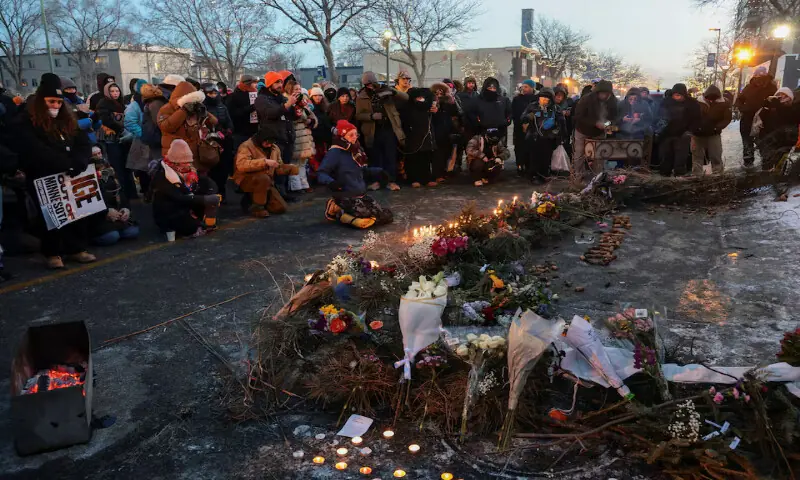 People gather around a makeshift memorial at the site where a man identified as Alex Pretti was fatally shot by federal agents in Minneapolis, Minnesota. &ndash; Reuters