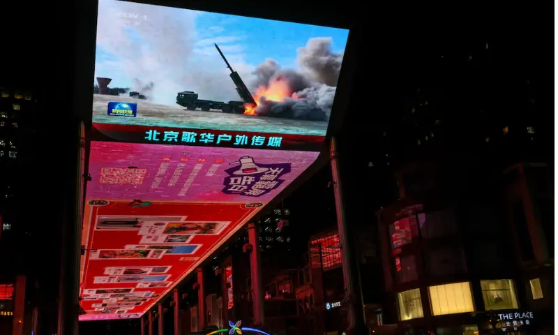 Taiwan sees only warships and warplanes as China talks peace with opposition