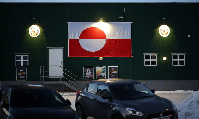 Independence remains popular in Greenland, which has long bridled over its colonial relationship with Denmark. Here, a Greenlandic flag is fixed to a building in Nuuk. &ndash; Reuters