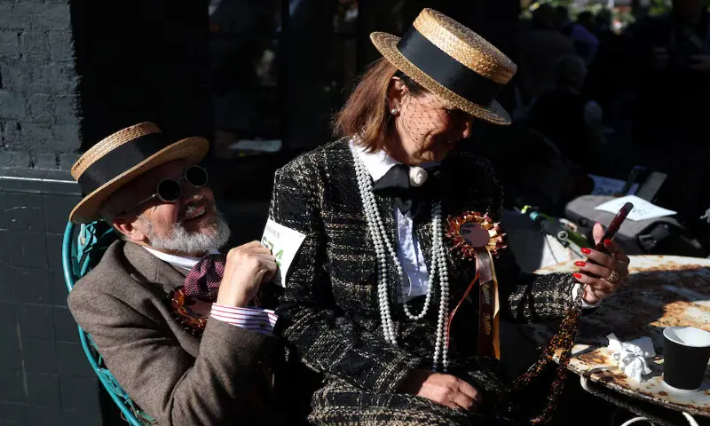 People rest before the start of the annual Tweed Run across London, Britain. &ndash; Reuters
