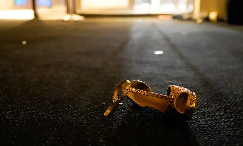 A shoe lies on the floor as people evacuate the annual White House Correspondents&rsquo; Association dinner after a shooting incident in Washington, DC. &ndash; Reuters
