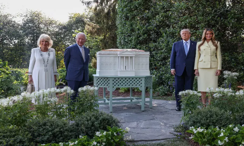 US President Donald Trump, first lady Melania Trump, Britain&rsquo;s King Charles and Queen Camilla pose next to the White House beehive on the South Lawn of the White House in Washington. &ndash; Reuters