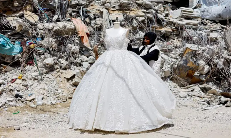 In war‑scarred Gaza, brides turn to refurbished wedding dresses