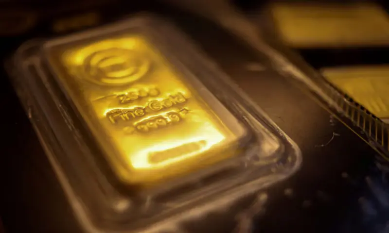Gold rises on weaker dollar, easing oil as investors assess US-Iran deal prospects