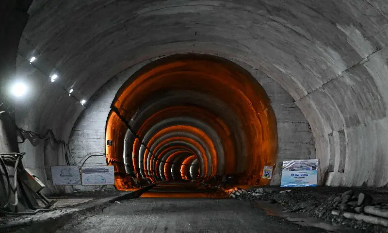 Lights illuminate the Zojila tunnel in Minamarg on June 9, 2026. AFP