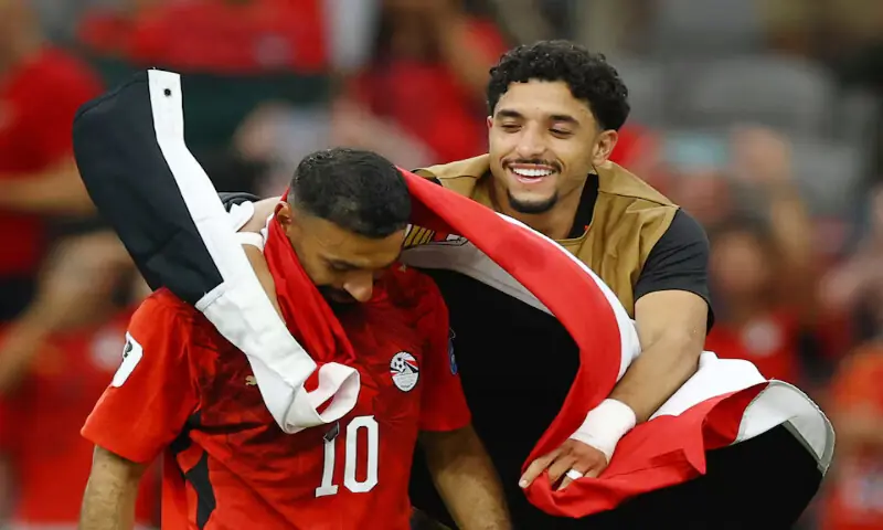 Egypt&rsquo;s Mohamed Salah celebrates with Omar Marmoush after the match. &ndash; Reuters