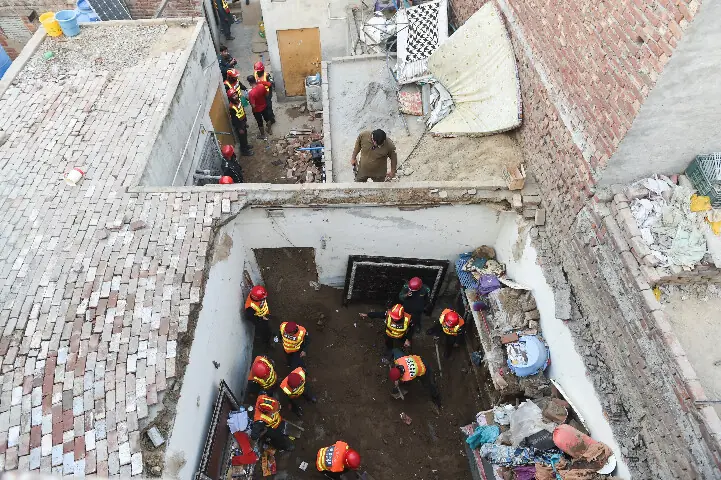  Rescue workers work at the site where children reportedly died after a tuition centre roof collapsed, in Lahore, Pakistan, on June 30, 2026. Reuters 