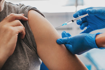 US hits vaccine milestone as NZealand, Australia open travel bubble