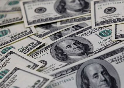Dollar pinned near one-month low amid subdued U.S yields