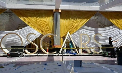 Tense Oscars race nears end as show aims to win back fans