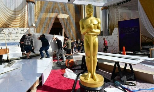 Oscars back in Hollywood as 'CODA' seeks top prize