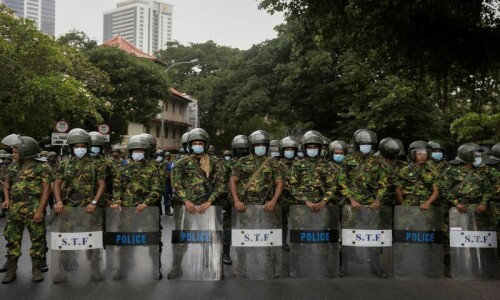 Sri Lankan security forces raid protest camp as new leaders sworn in